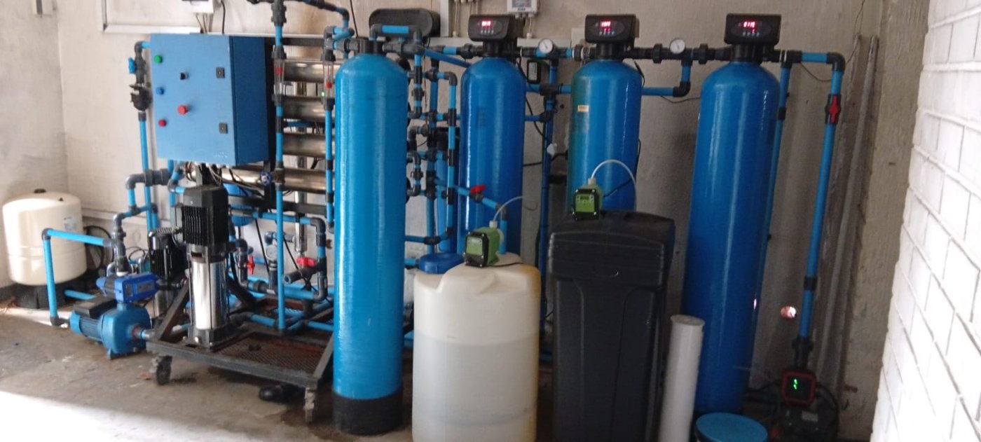 A closer view of filtration vessels, pipework and supporting water treatment equipment.